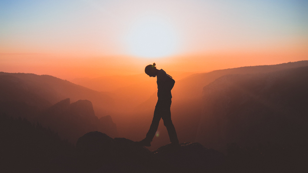 Man hiking at sunset