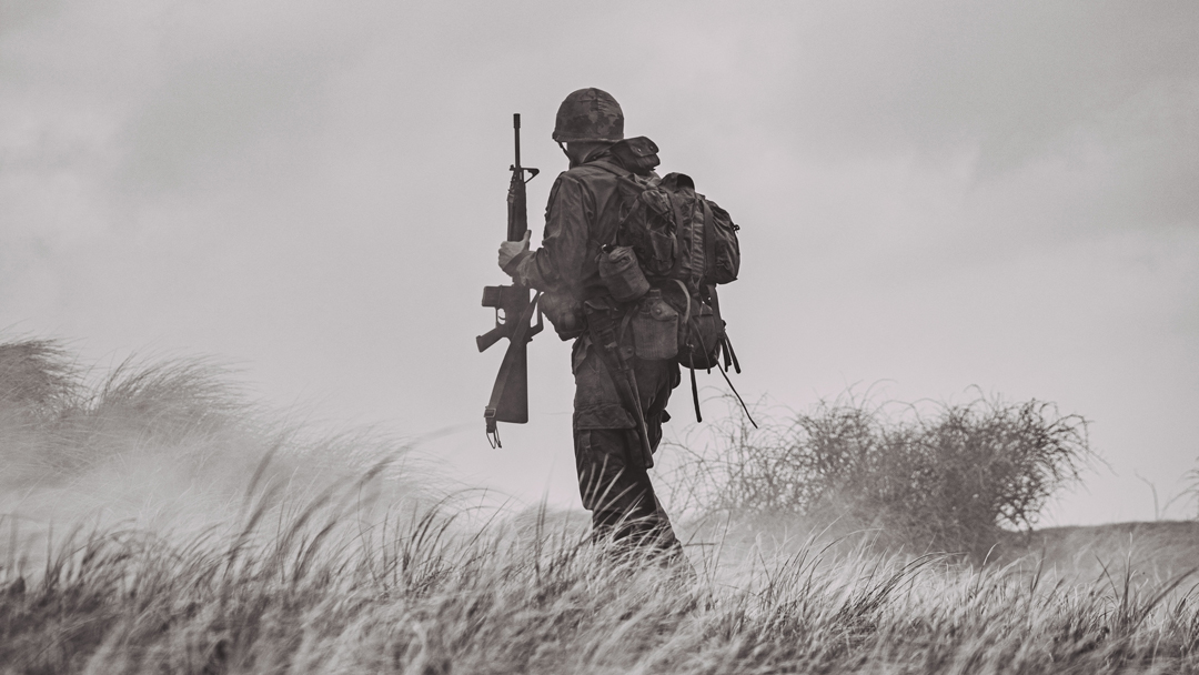 Soldier holding a rifle in battle