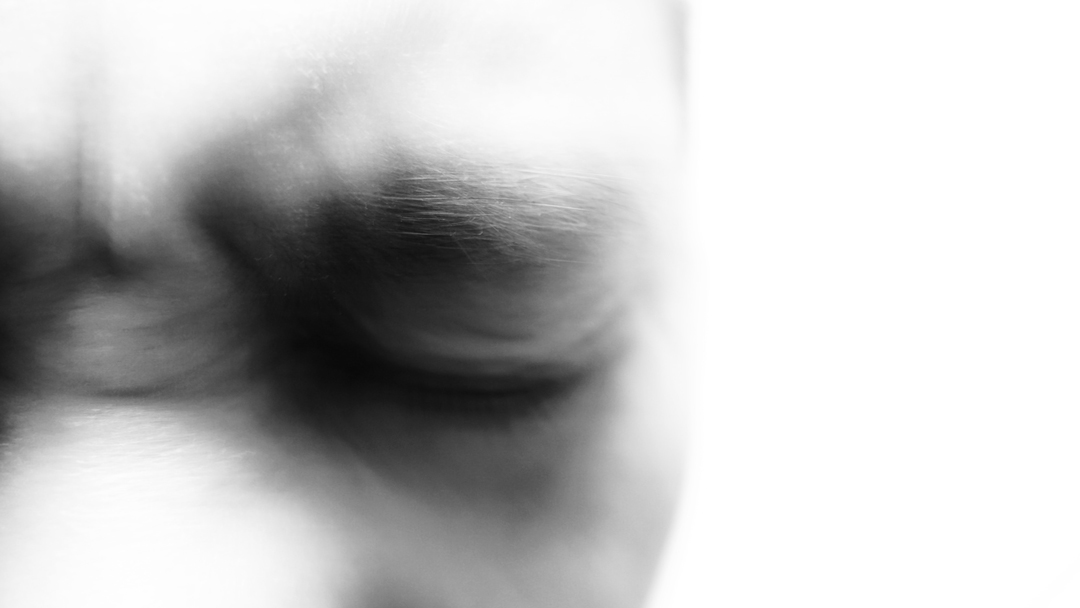 Close up of a mans closed eyes