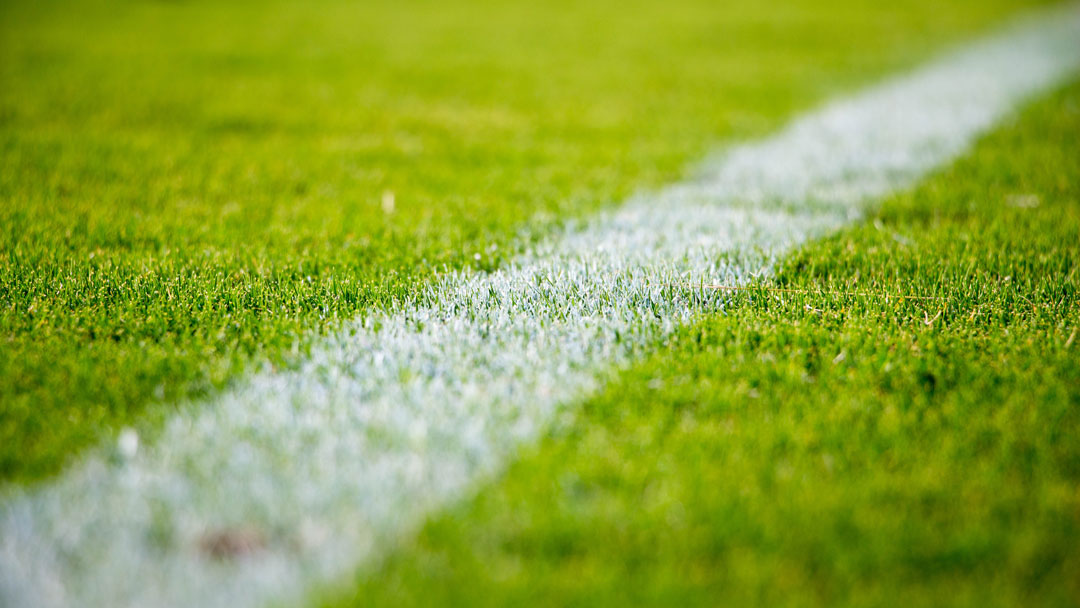 Chalk line on grass field