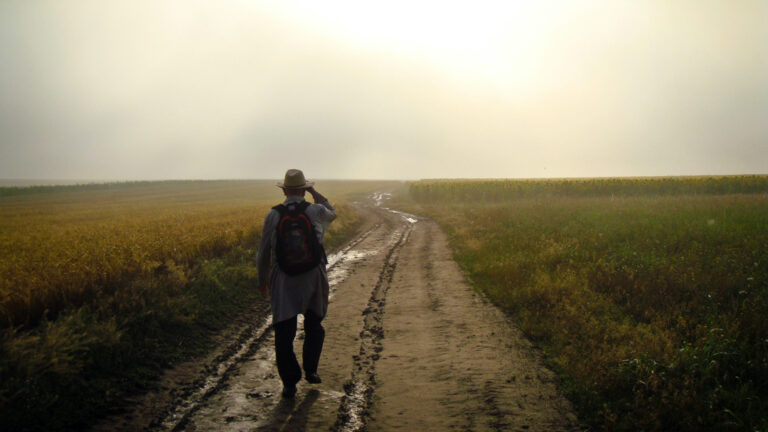 man walking on a field