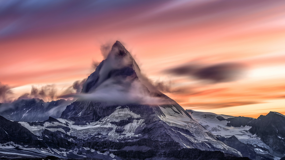 snowy mountain at sunset