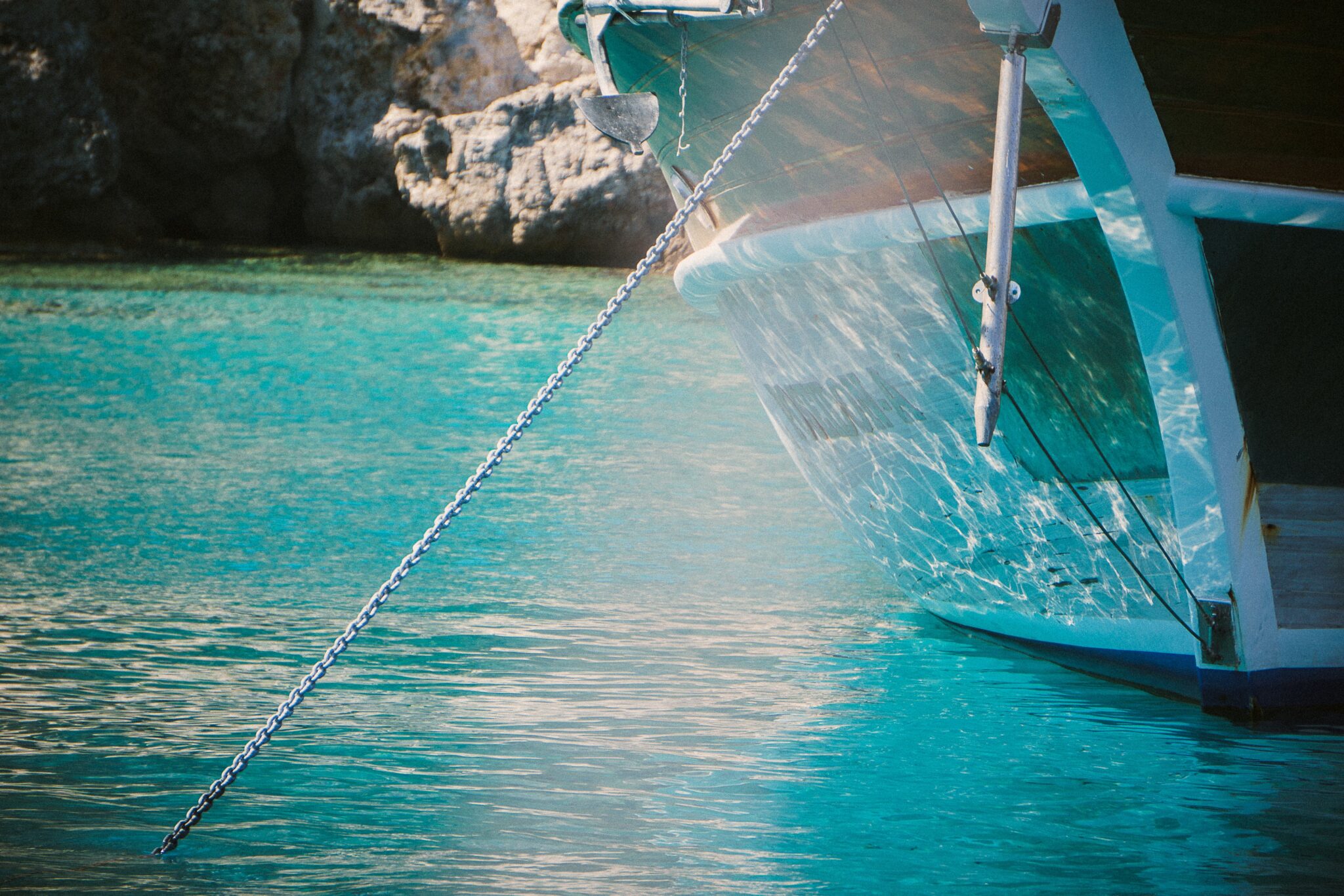 Anchored boat in blue water