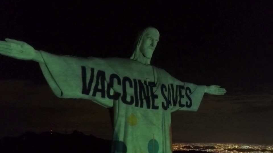 Statue of Jesus with the words Vaccine Saves written on it