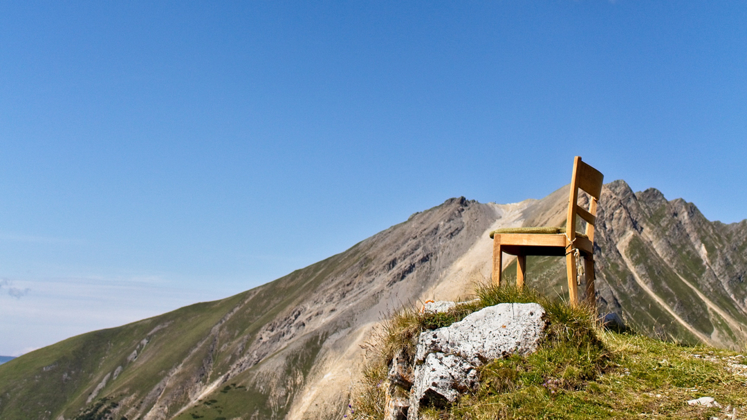 Chair on top of a mountain
