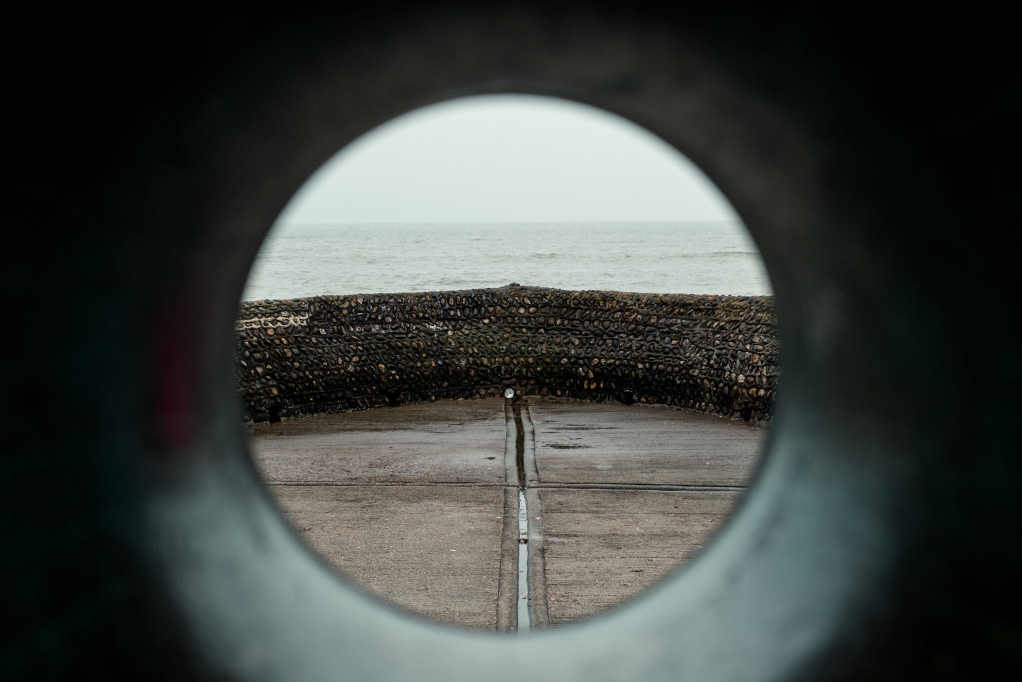 Circular scope of rock wall on coastline