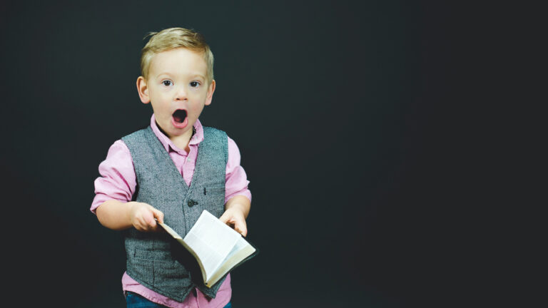 Little boy holding a Bible