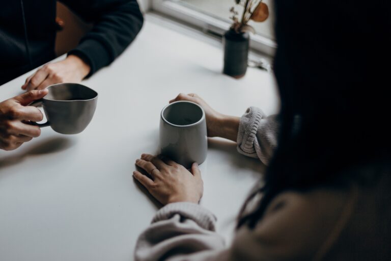 Man and a woman having coffee together