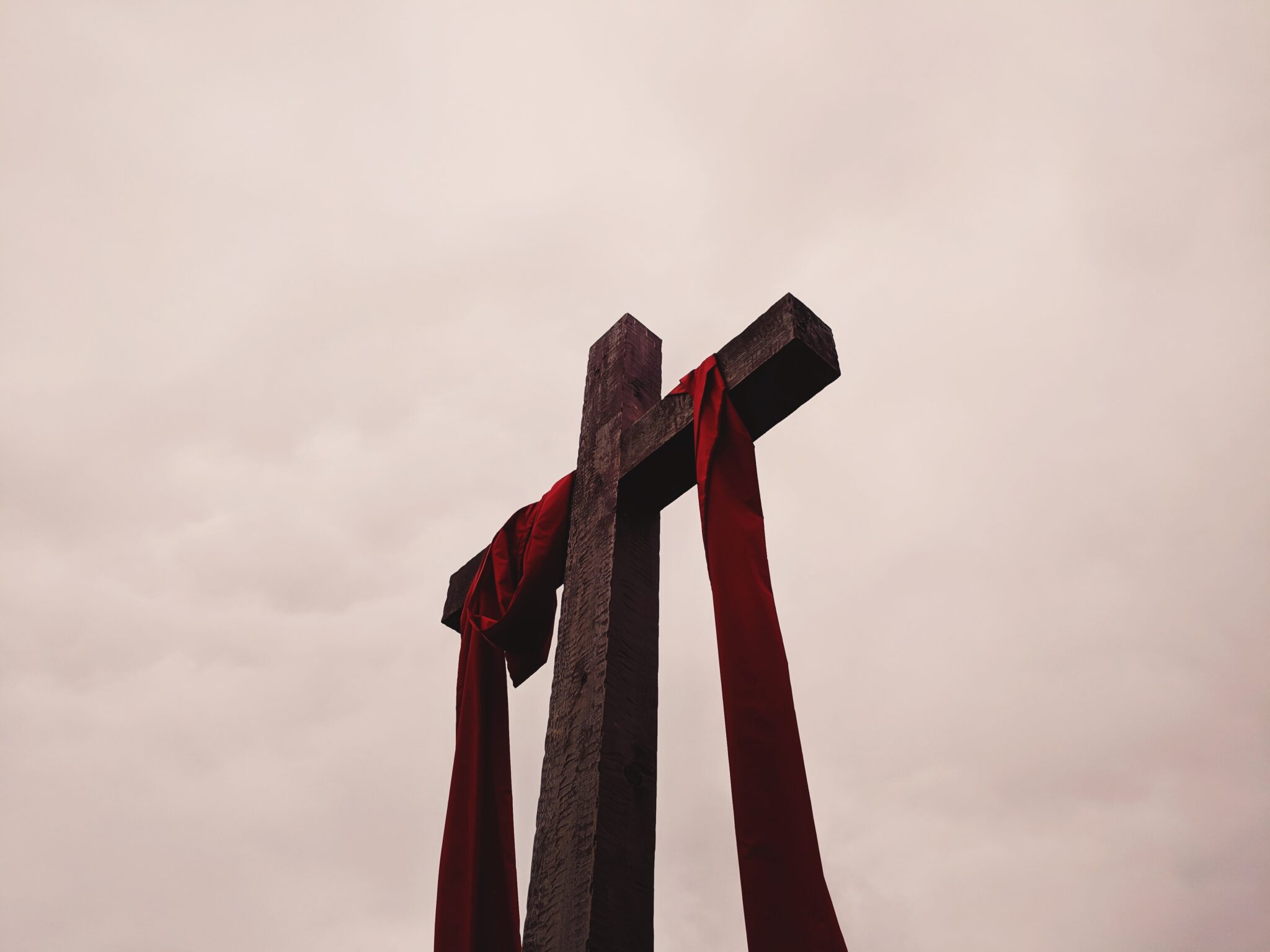 Cross with red cloth draping down