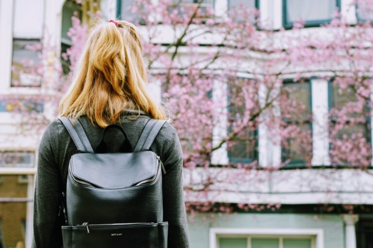 Woman looking at cherry blossoms