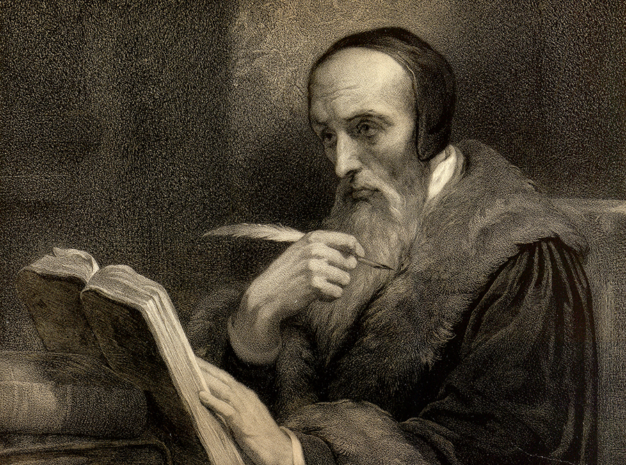 Old photo of a man reading and writing with a quill