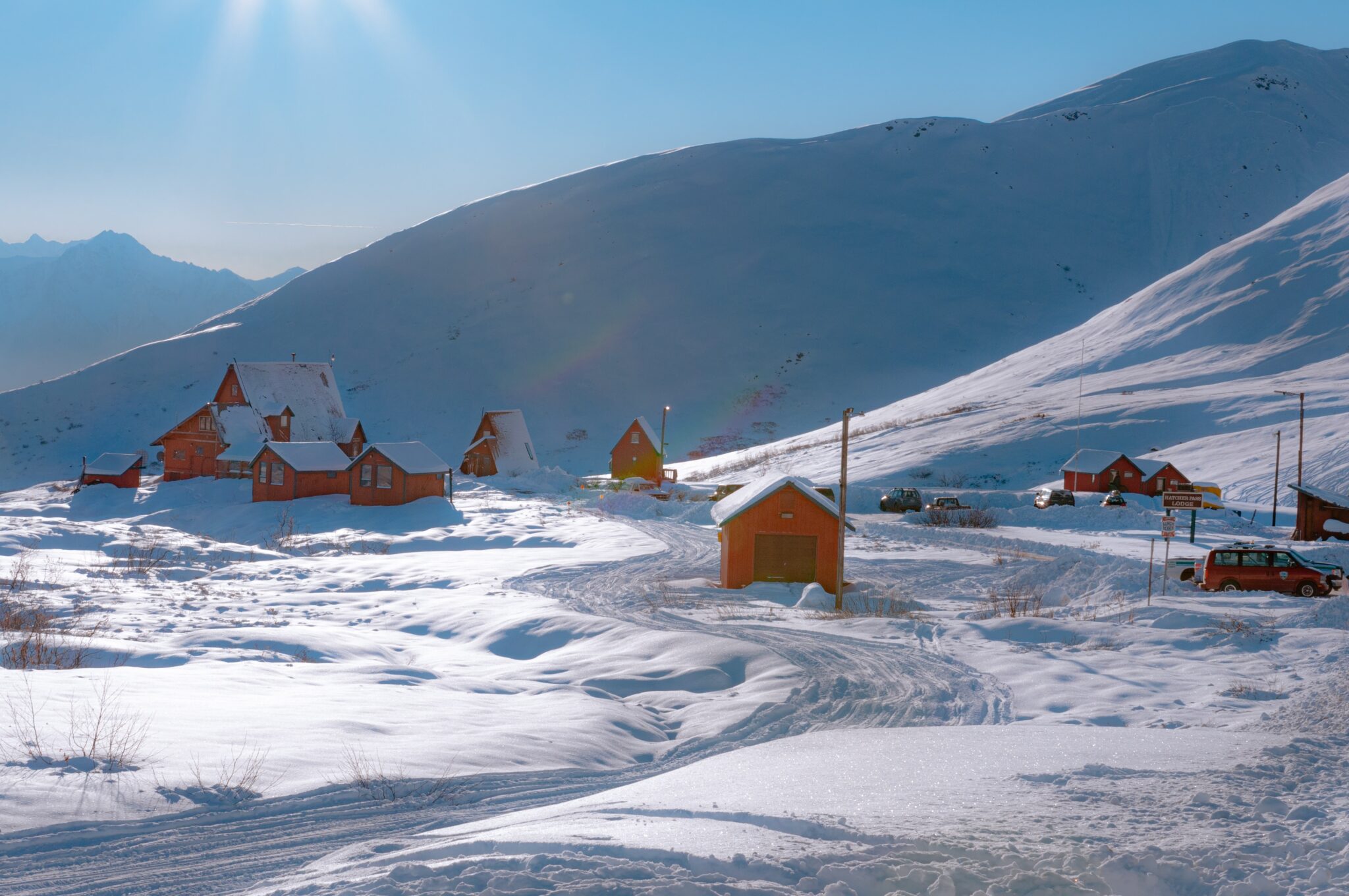 Orange houses and structures in a very snowy mountain