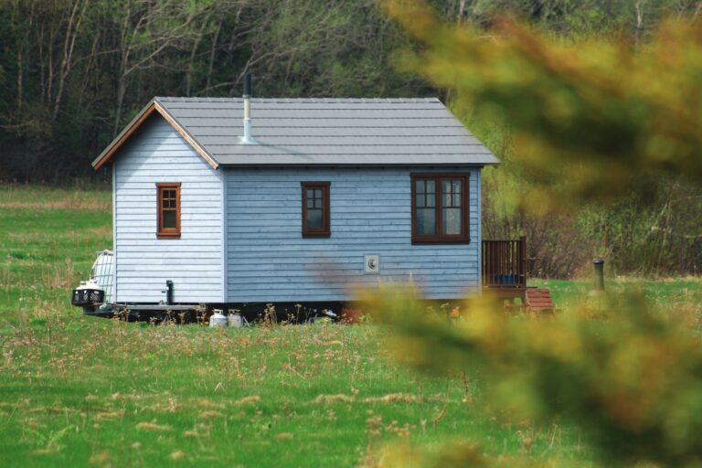 Small house in a green grass field