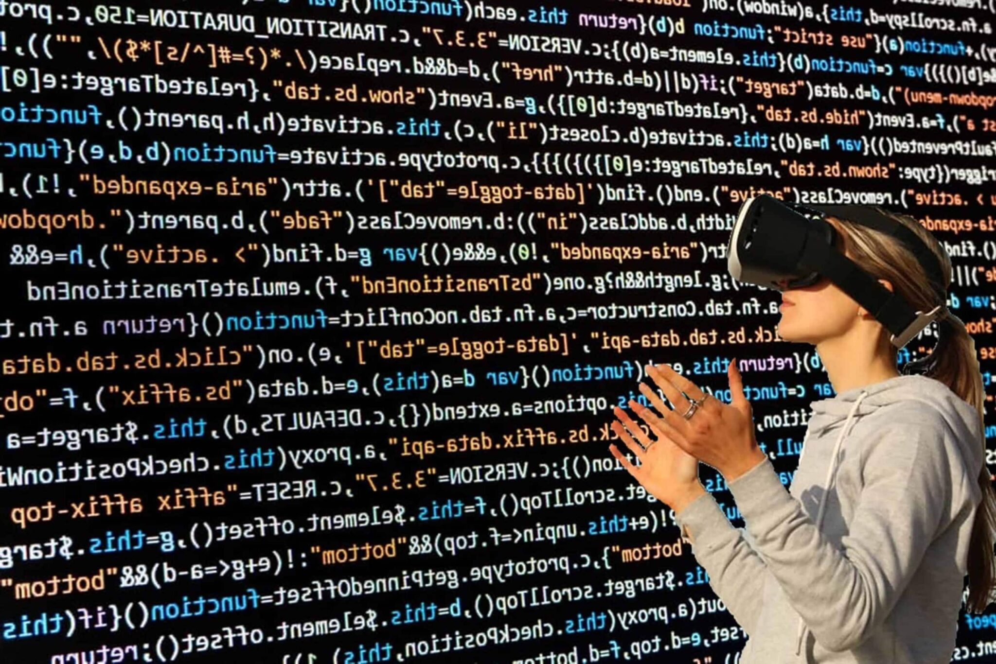 Woman with a VR headset looking at a bunch of computer code