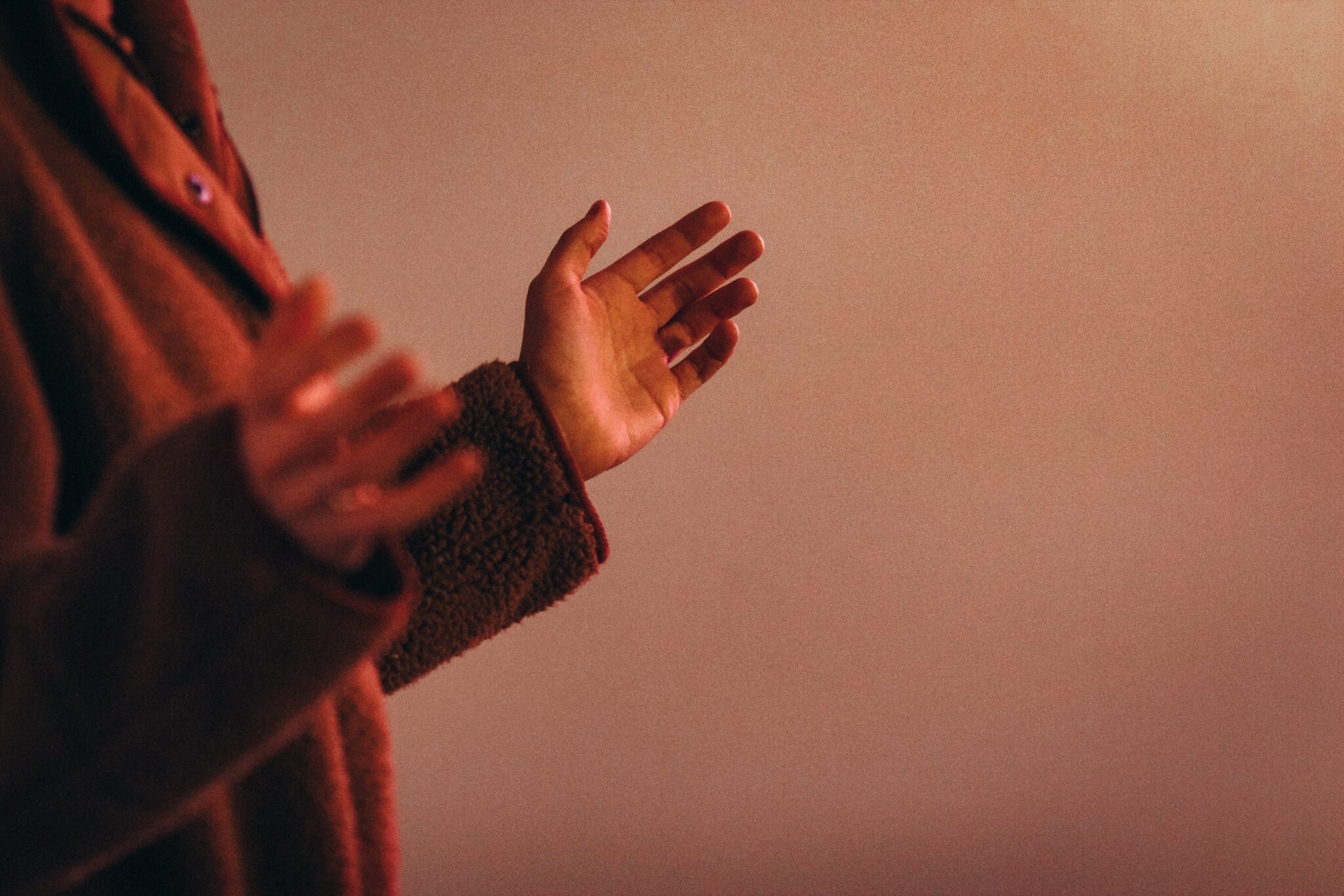 Woman holding her hands up in praise