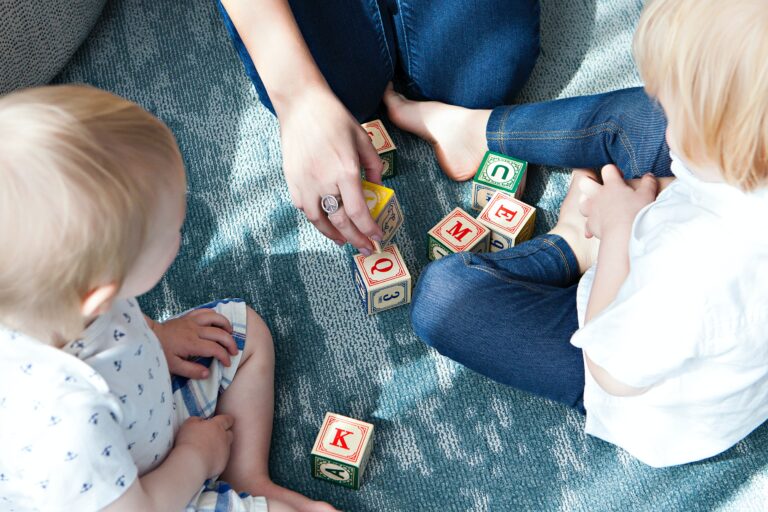 Kids playing with letter blocks